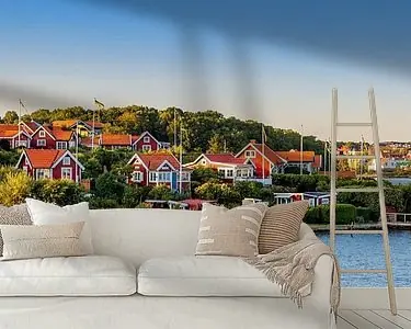 Rode Zweedse huisjes tijdens het Gouden uur Premium