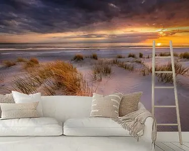 Zwrot pieniędzy Zonsondergang op het strand van Westerschouwen op Schouwen-Duivenland in Zeeland met duinen op de vo
